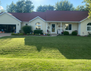 Homeowner reviewing a roof warranty document for an Illinois home